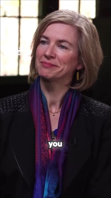 Vizard vertical clip showing Jennifer Doudna listening while Dan Rather speaks